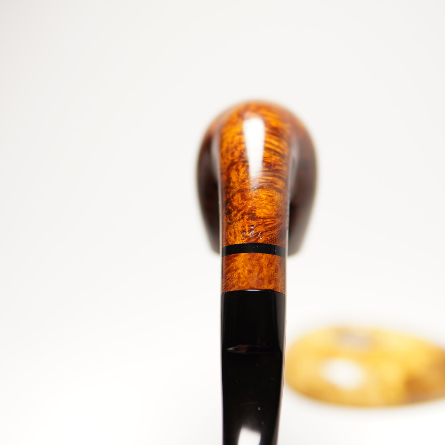 Wooden smoking pipe with a black accent on a white background