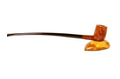 Wooden pipe on a stand with a plain background
