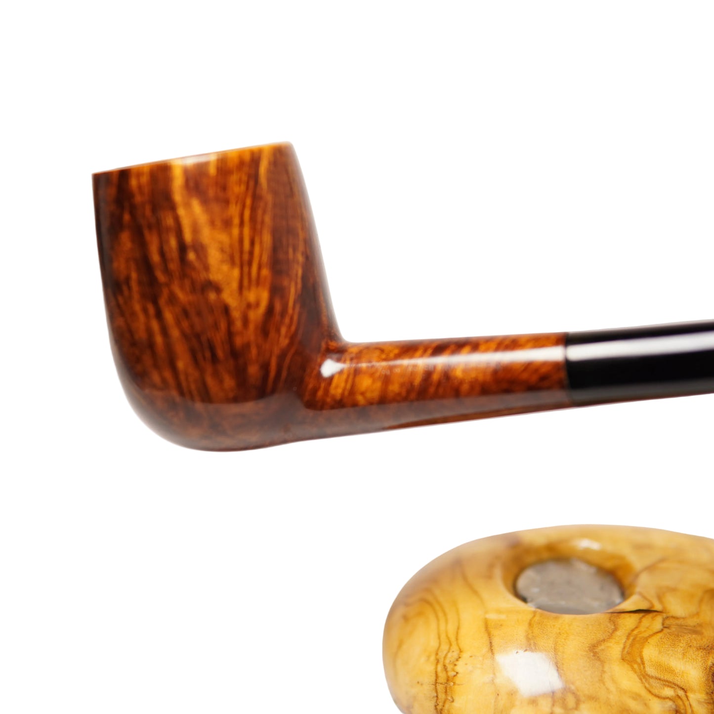 Wooden pipe with a detailed pattern on a light gray background