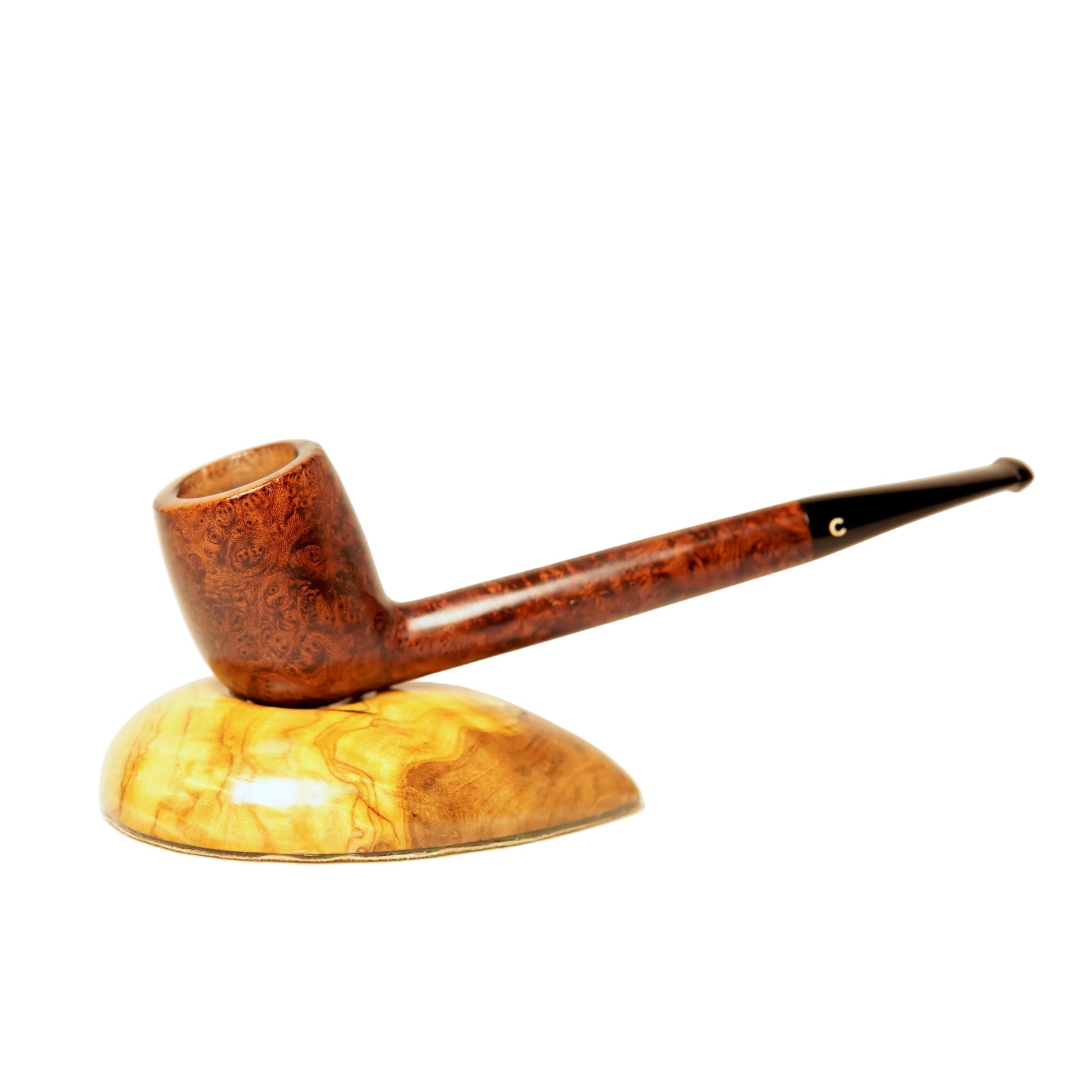 Wooden smoking pipe on a wooden stand with a white background
