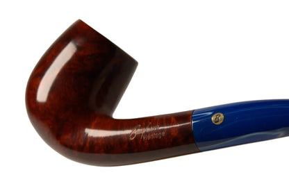 A close-up studio shot of a smoking pipe with a glossy dark brown wood bowl and a bright blue handle, resting above a small wooden stand on a neutral light gray background.