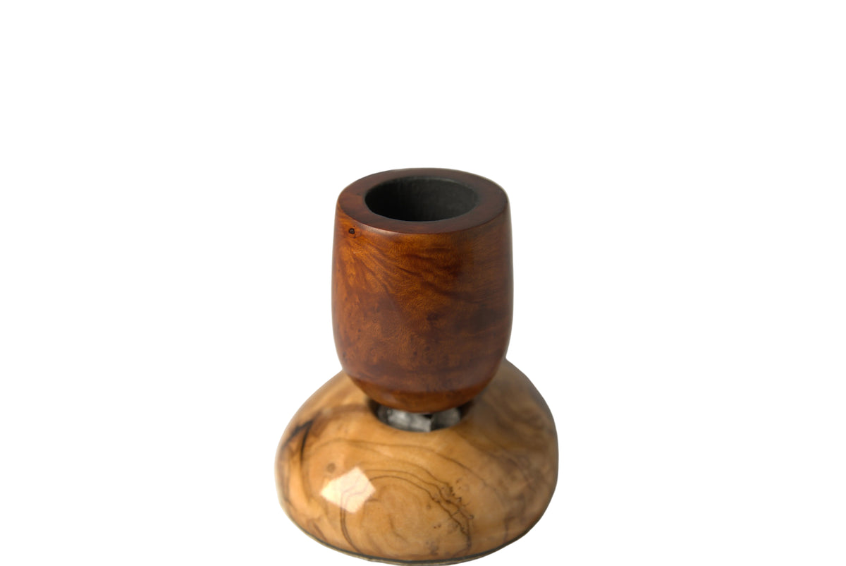 A wooden smoking pipe with a polished reddish-brown top section and a natural light wood base, displayed on a neutral light gray background.