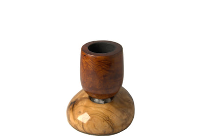 A wooden smoking pipe with a polished reddish-brown top section and a natural light wood base, displayed on a neutral light gray background.
