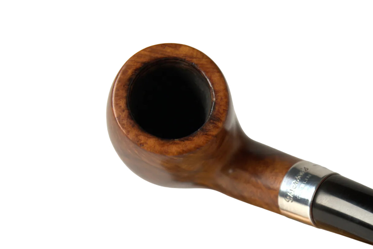 A close-up of a smoking pipe with a polished brown wooden bowl and a glossy black stem, held by a hand over a matching wooden stand on a neutral light gray background.