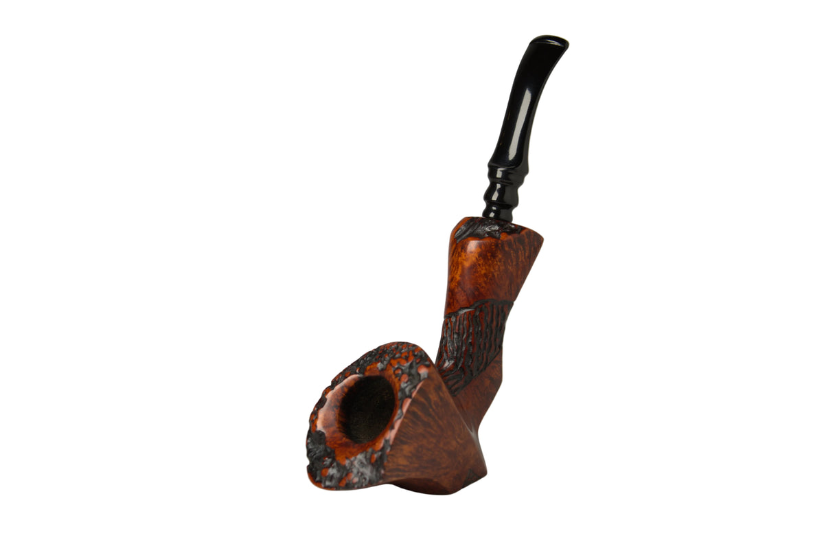 A carved smoking pipe with a rich reddish-brown wood body, dark textured detailing, and a glossy black stem, photographed on a neutral gray studio background.