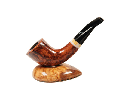 A smoking pipe with a richly figured brown wood bowl and a glossy black stem, resting on a matching polished wood display stand against a clean white background.