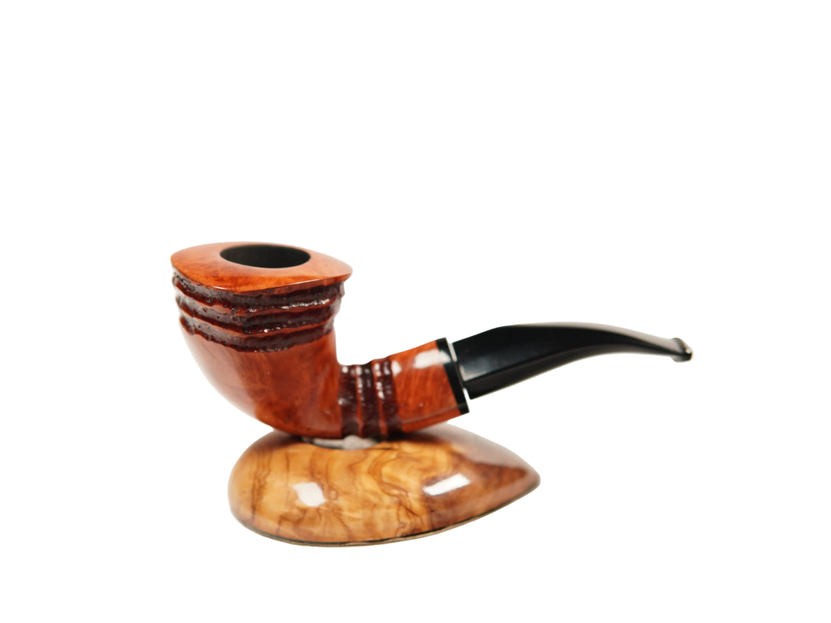 A smoking pipe with a curved reddish-brown wooden bowl, a glossy black stem, and a matching polished wood resting base, photographed on a clean white background.