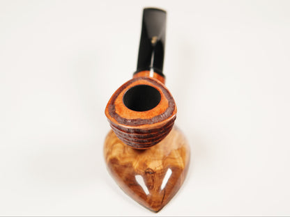 A handcrafted smoking pipe with a polished, wavy brown wood bowl and a black stem, photographed on a seamless white background.