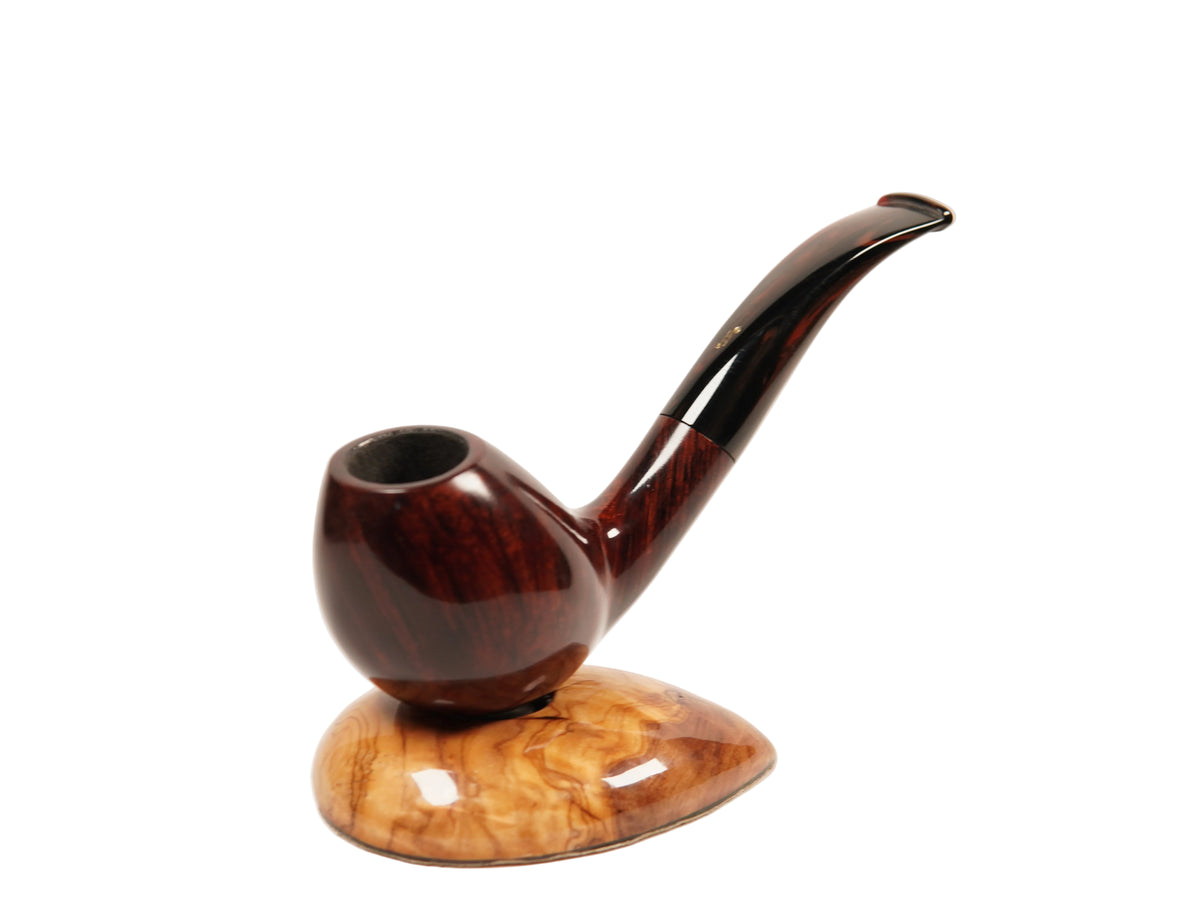 A polished dark brown wooden smoking pipe with a curved stem, displayed on a matching carved wooden stand against a plain white background.