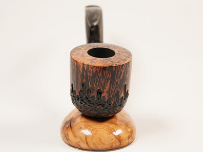 A handcrafted wooden smoking pipe with a dark brown burl wood bowl, a carved dark base, and a lighter tan wood foot, featuring a dark stem, photographed on a seamless white background.