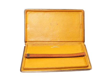 A rectangular brown leather portfolio folder or notebook cover with a silver metal edge, shown closed on a plain white background.
