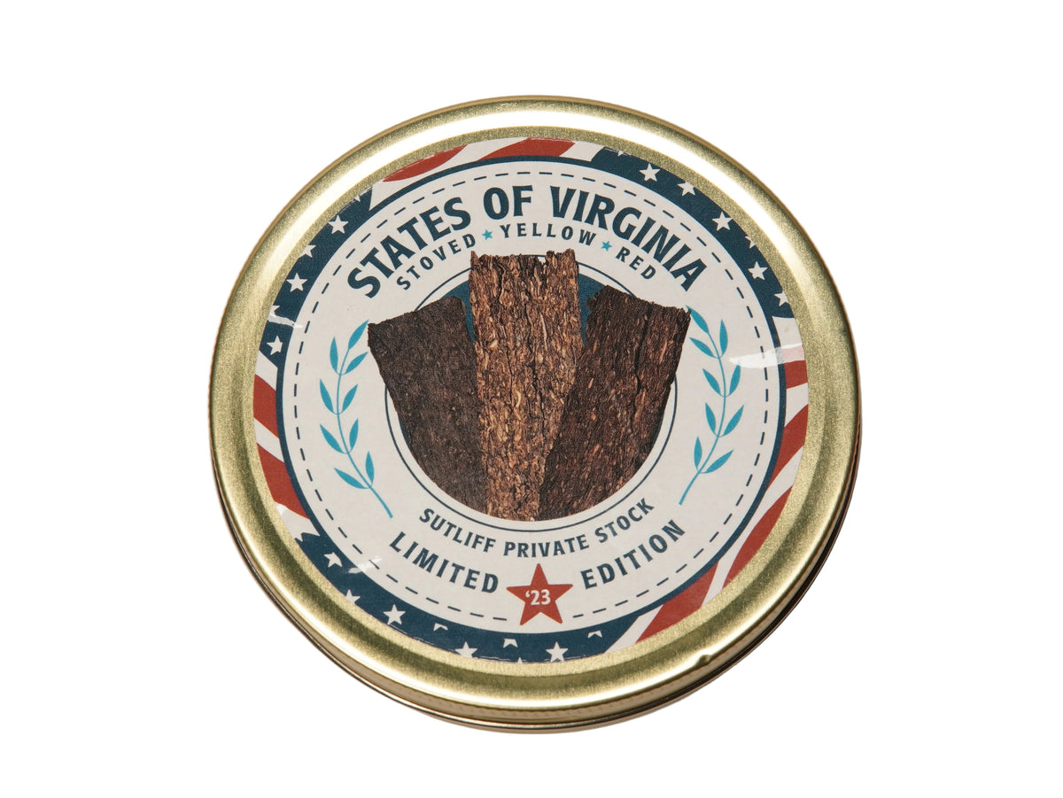 A round metal tin of States of Virginia Doped Yellow Rubber, Limited Edition, on a plain off-white background.