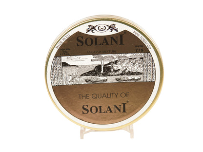 A round tin of Solani English Mixture Pipe Tobacco 774 on a small clear display stand against a plain white background.