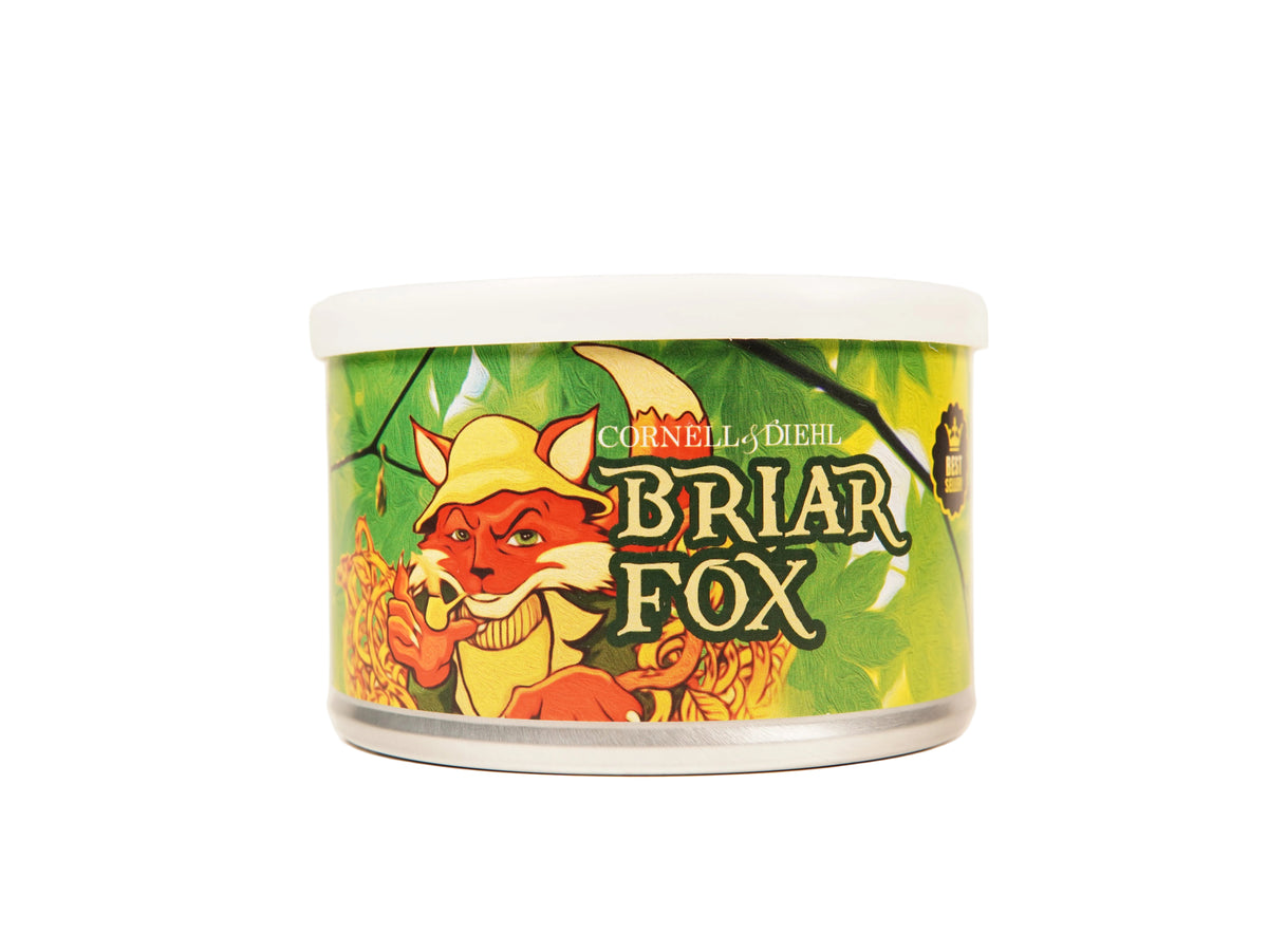 A cylindrical metal can of Cornely-Diehl Briar Fox cat food, featuring a colorful label with an illustration of a red fox wearing a yellow hat against a green leafy background.