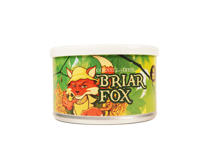 A cylindrical metal can of Cornely-Diehl Briar Fox cat food, featuring a colorful label with an illustration of a red fox wearing a yellow hat against a green leafy background.