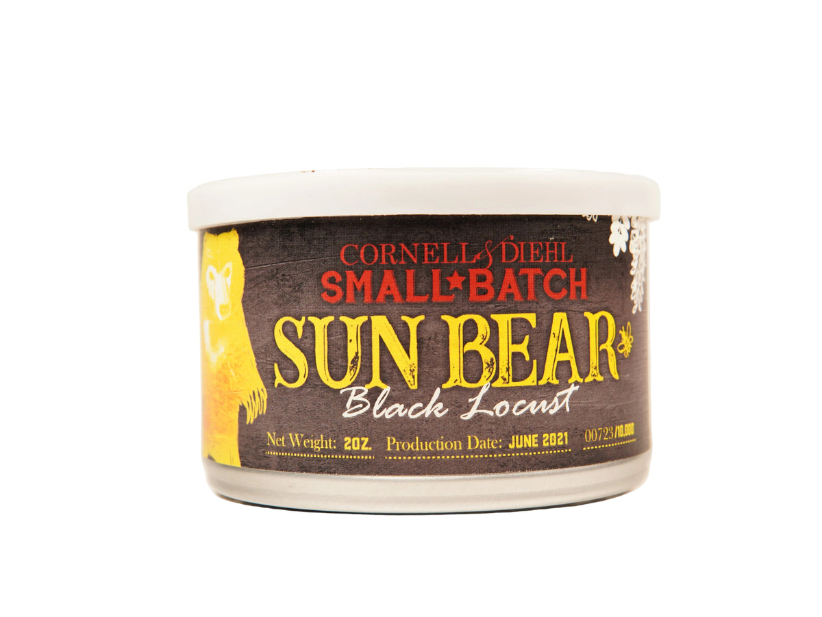 A 2 oz jar of Cornell & Diehl Small Batch Sun Bear Black Locust wax melt, featuring a dark brown label with yellow and red lettering and a white lid, set against a plain off-white background.