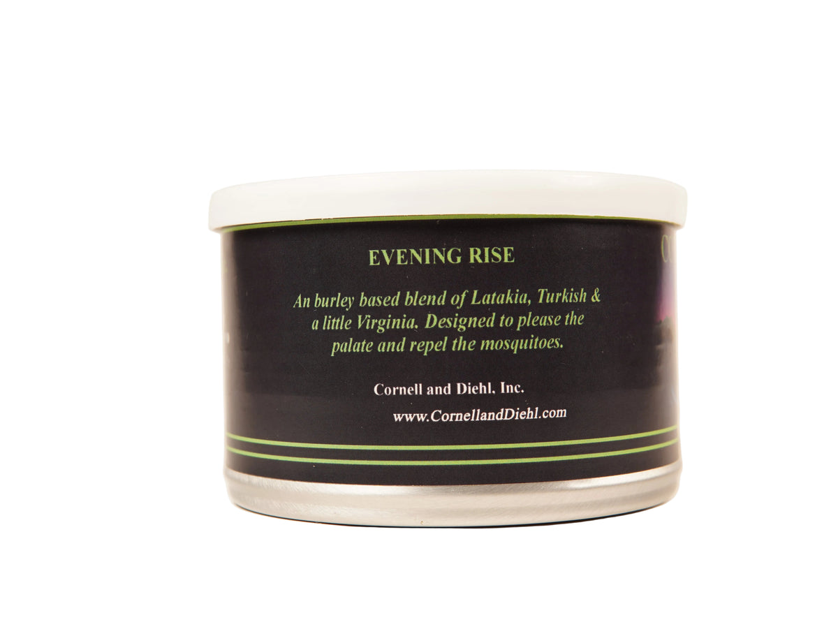 Cornell and Diehl Evening Rise burley candle in a round white-lidded tin with a black label, photographed against a plain off-white background.